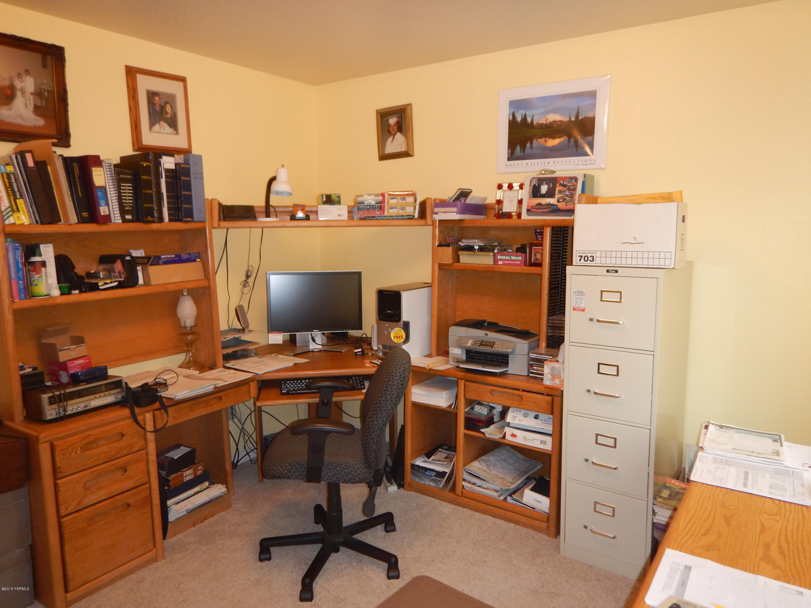 4911 Mieras Road Yakima, WA 98901 - Photo 48 of 58 a view of a workspace with furniture and bookshelf