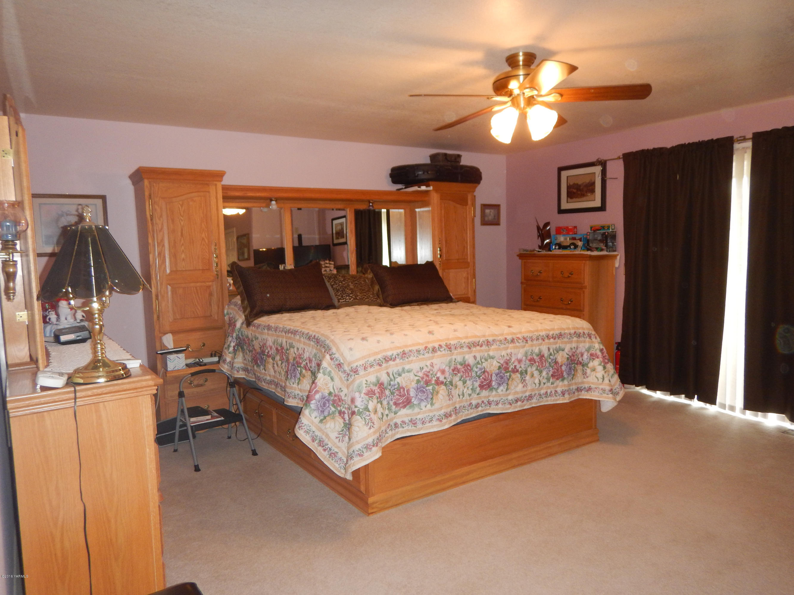 4911 Mieras Road Yakima, WA 98901 - Photo 50 of 58 a bedroom with a bed dresser and a window