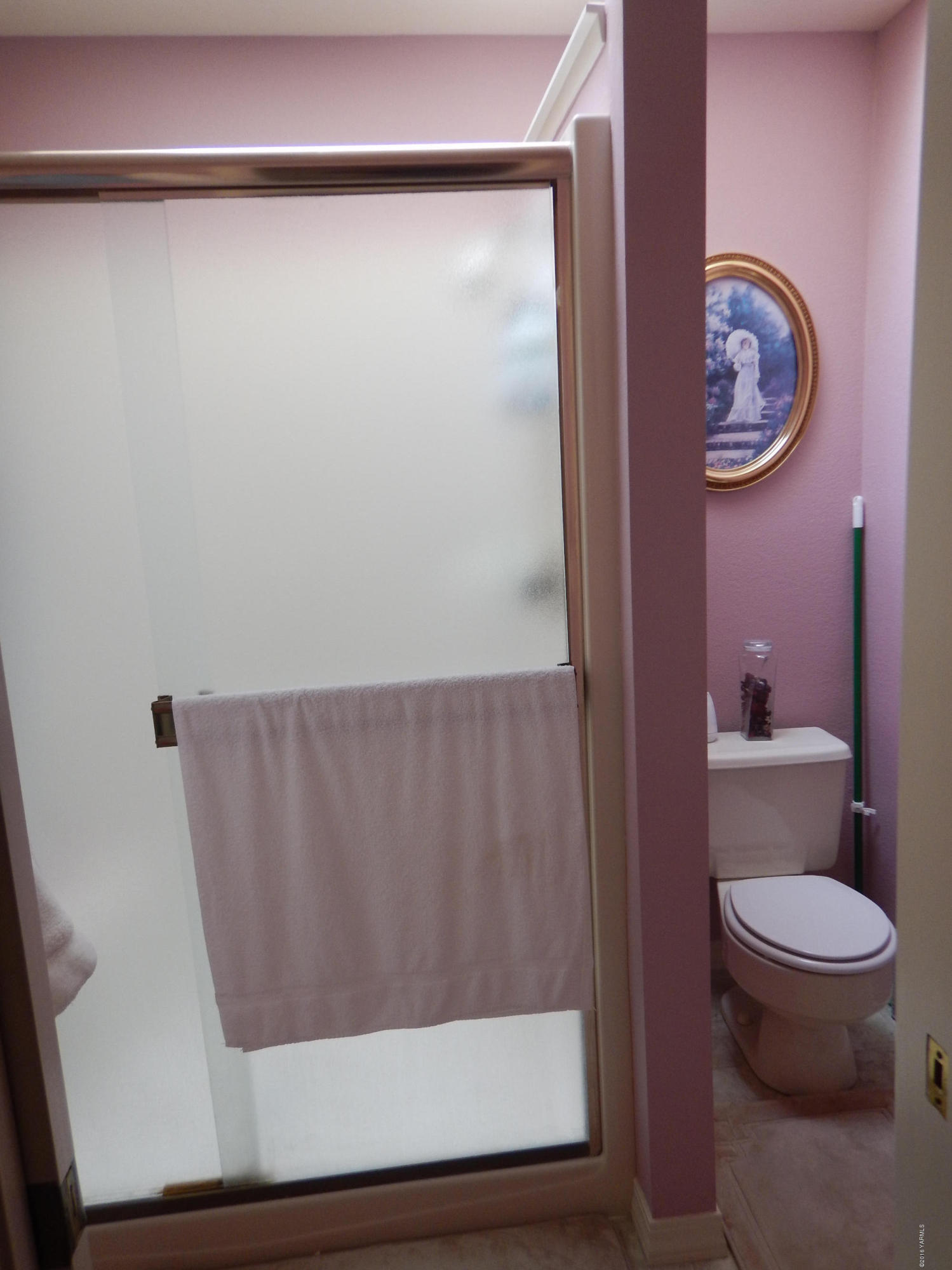 4911 Mieras Road Yakima, WA 98901 - Photo 53 of 58 a bathroom with a toilet and a shower curtain