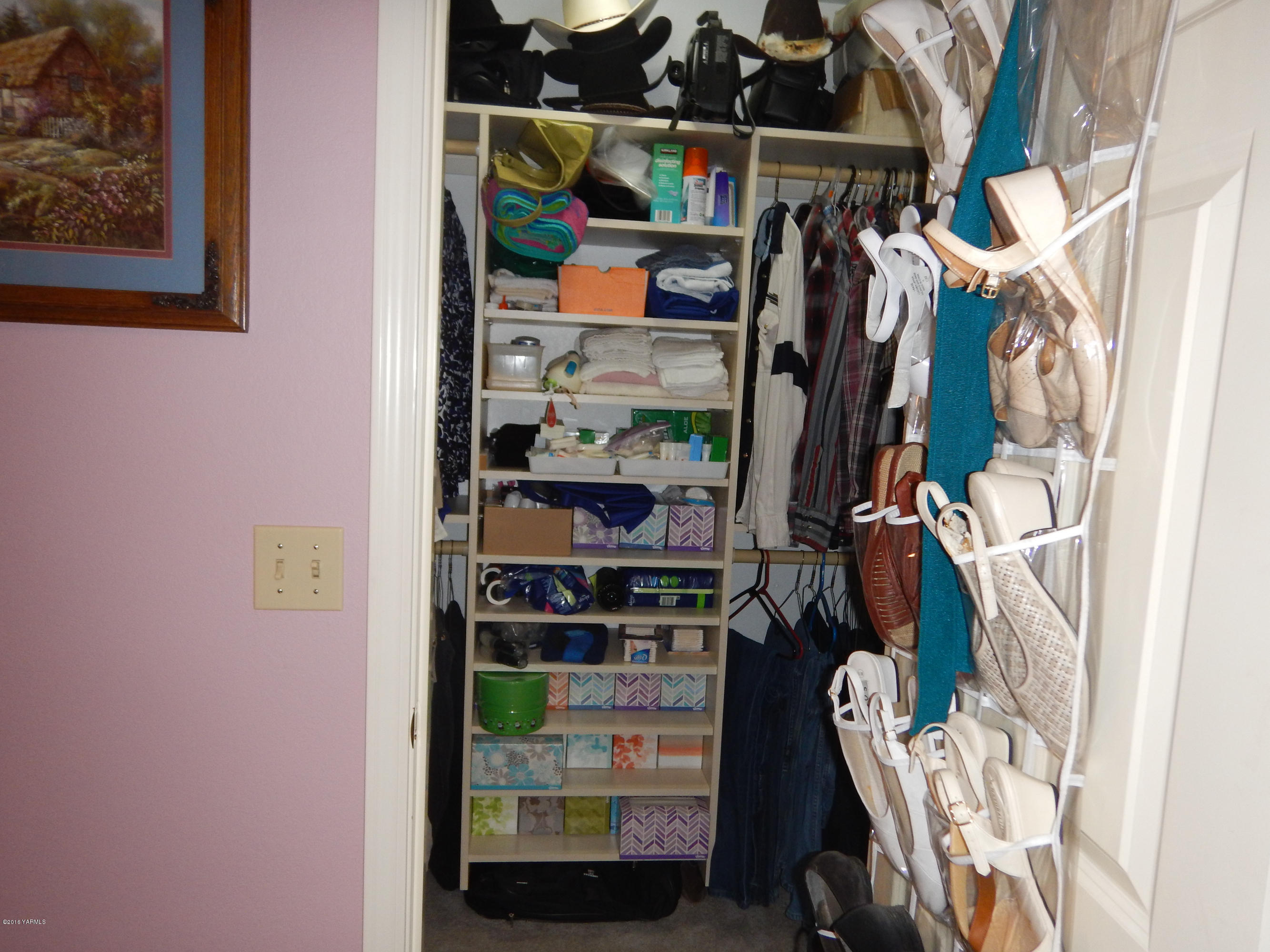 4911 Mieras Road Yakima, WA 98901 - Photo 54 of 58 a view of walk in closet with clothes and shoes