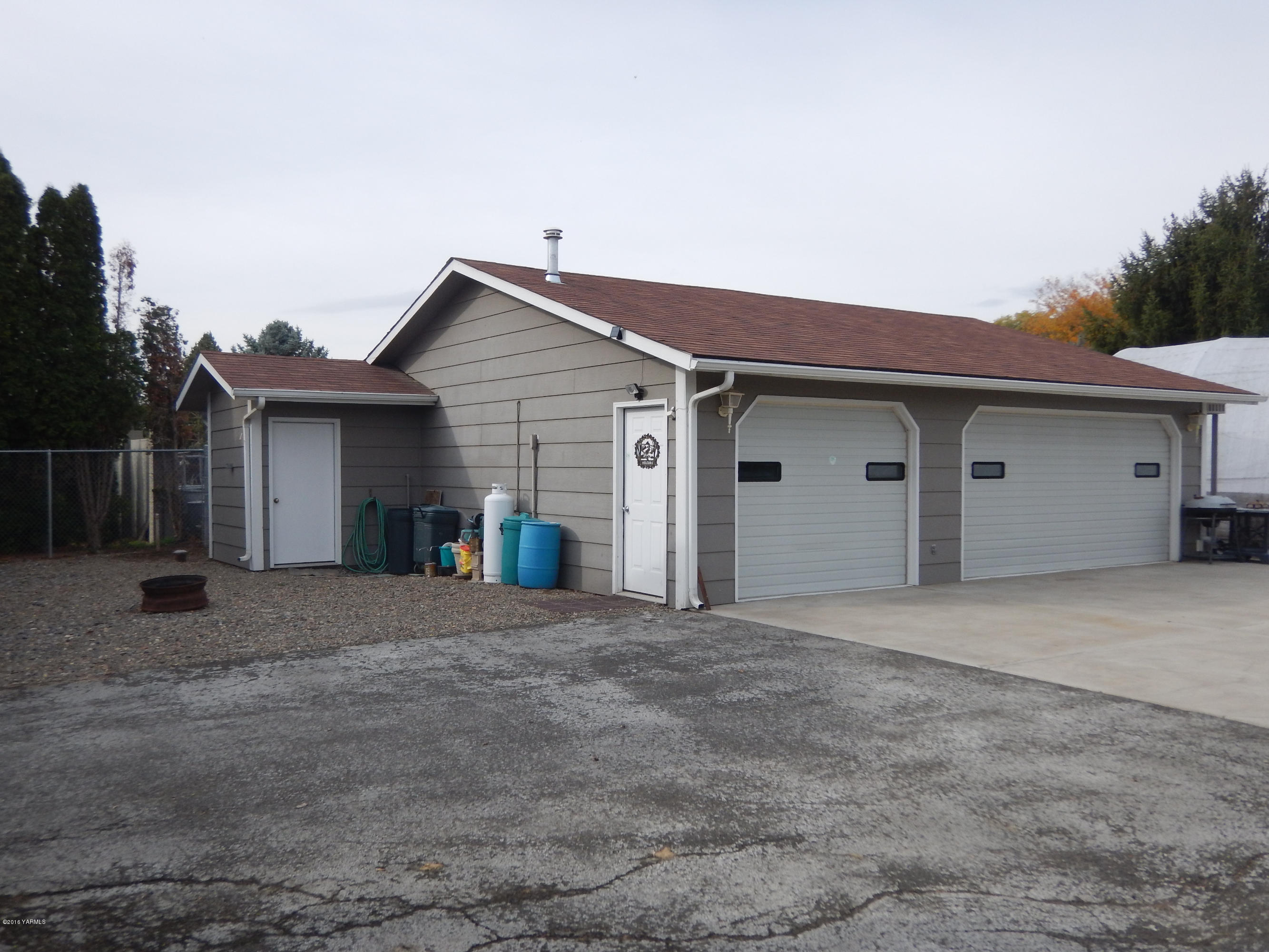 4911 Mieras Road Yakima, WA 98901 - Photo 7 of 58 a view of a house with a flat screen tv and a large window