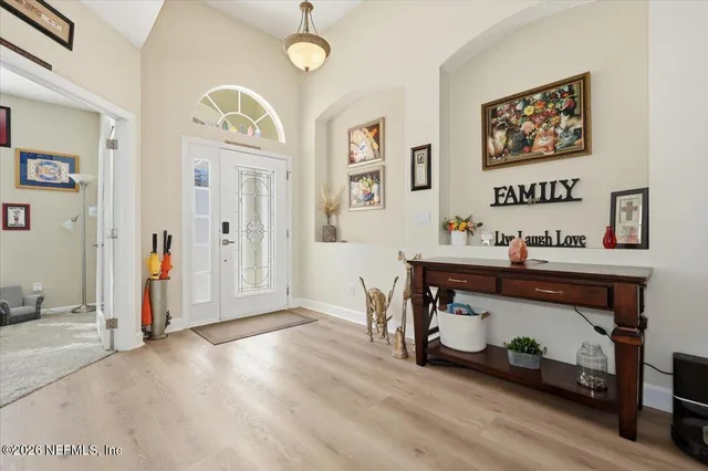 a living room with furniture cabinets and window