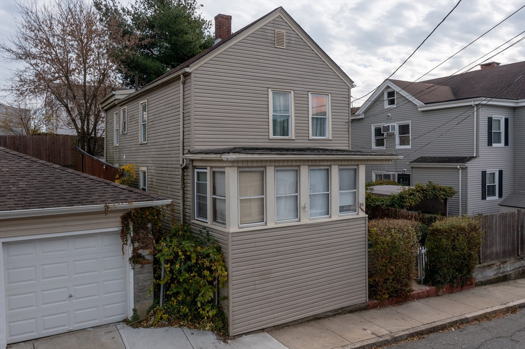 89 Oak Street Fall River, MA 02720 - Photo 2 of 39 a view of a house with a garage