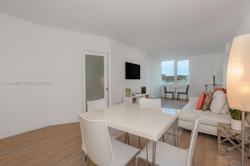 2301 Collins Avenue, Unit 927 Miami Beach, FL 33139 - Photo 11 of 30 a view of a dining room with furniture
