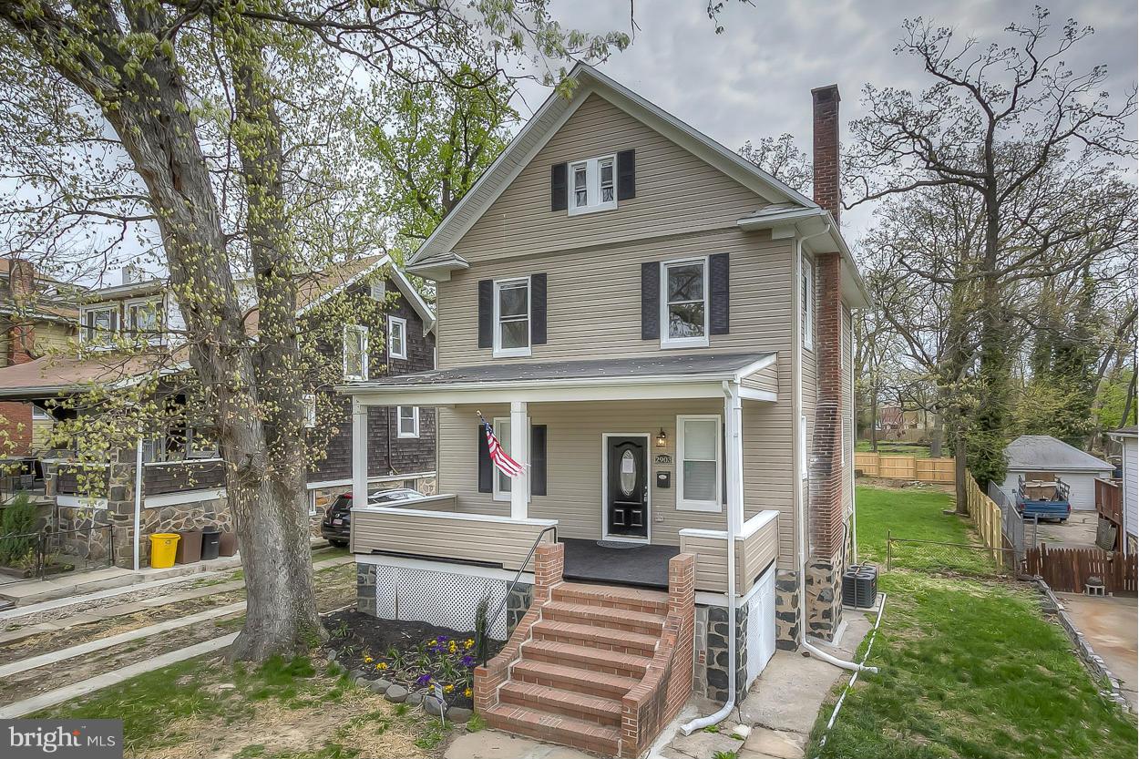2903 Allendale Road Baltimore, MD 21216 - Photo 1 of 30 a front view of a house with garden