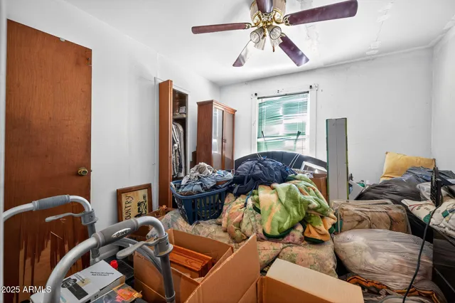 a bedroom with furniture and a chandelier