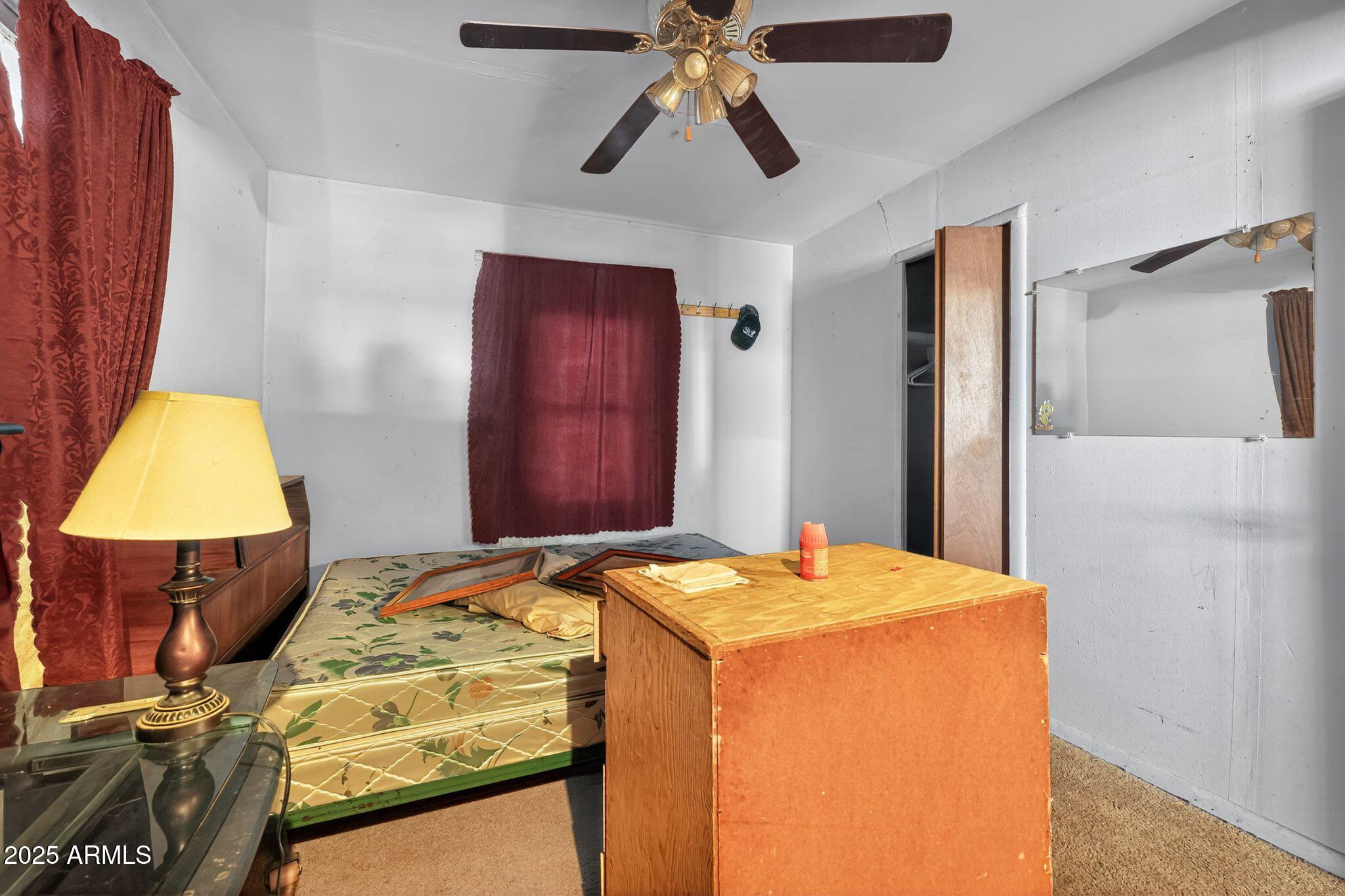 198 Randall Avenue Winkelman, AZ 85192 - Photo 18 of 30 a bed room with a bed and a lamp