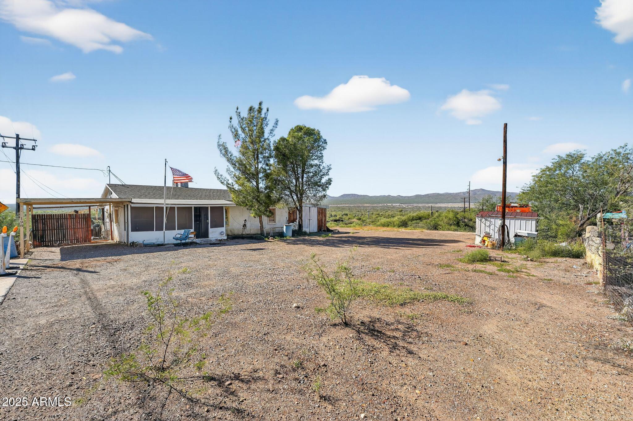 198 Randall Avenue Winkelman, AZ 85192 - Photo 3 of 30 a view of a house with a yard and a car park in front of it