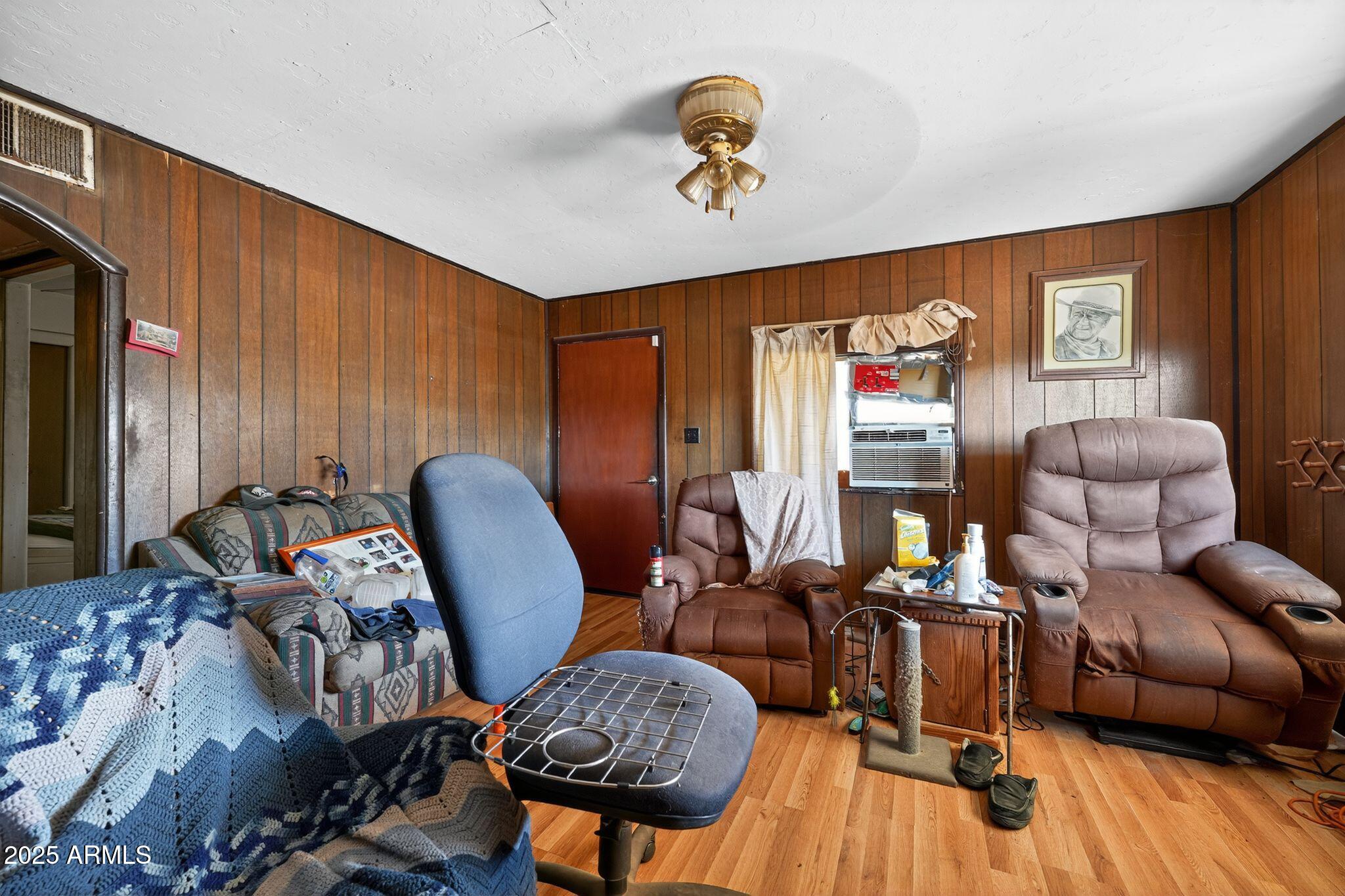 198 Randall Avenue Winkelman, AZ 85192 - Photo 7 of 30 a view of a livingroom with furniture and a potted plant