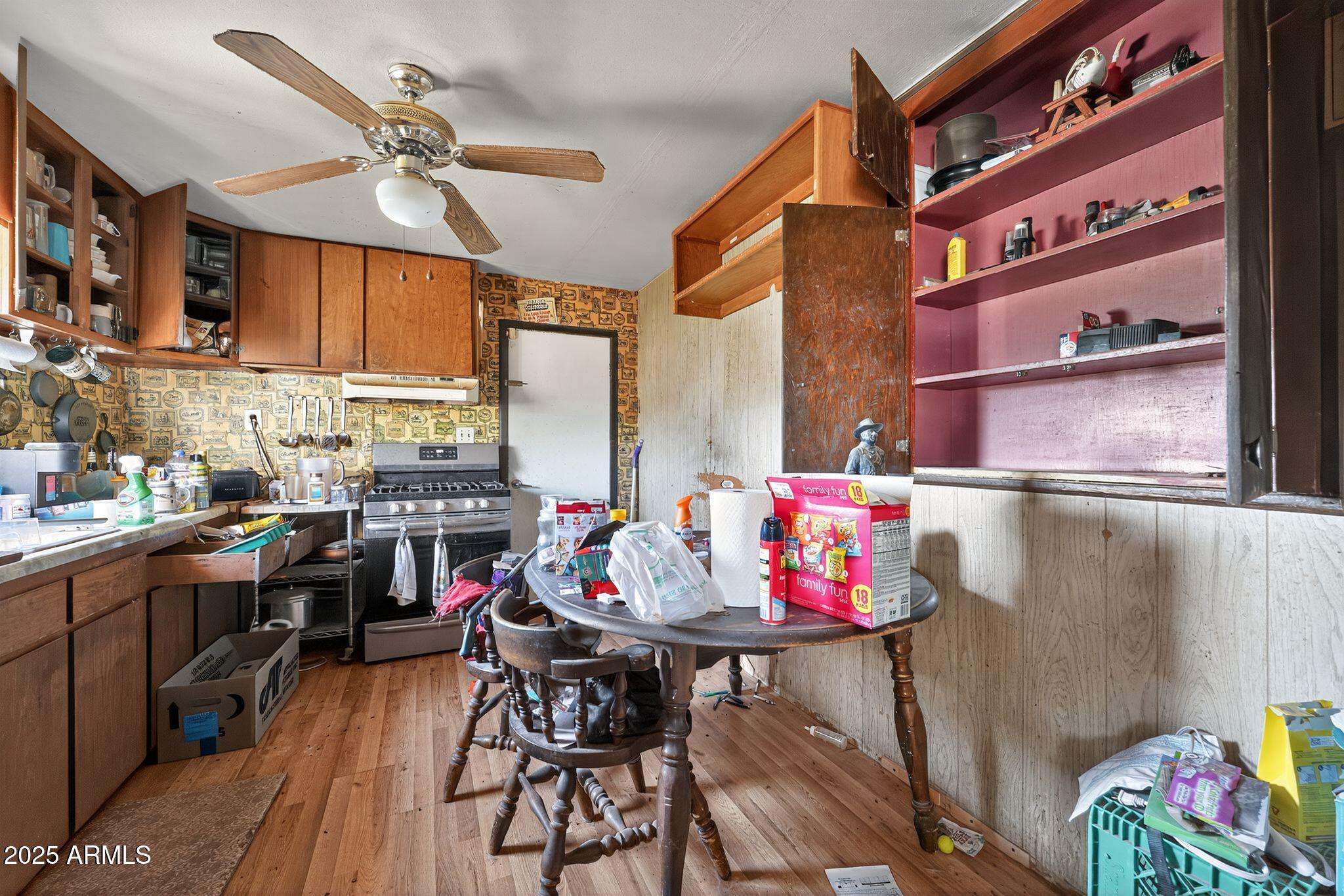 198 Randall Avenue Winkelman, AZ 85192 - Photo 9 of 30 a view of a dining room with furniture and wooden floor