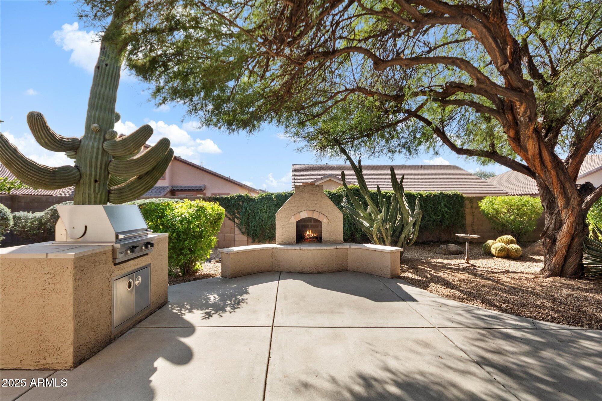 4825 East Kirkland Road Phoenix, AZ 85054 - Photo 26 of 30 Buit-in BBQ and fireplace