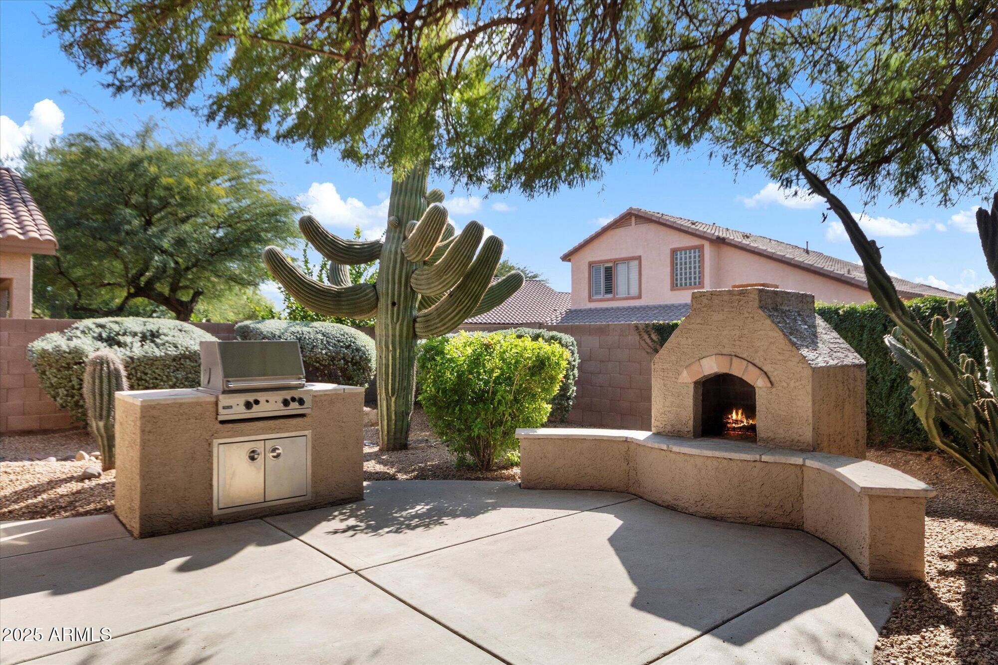 4825 East Kirkland Road Phoenix, AZ 85054 - Photo 28 of 30 Builtin BBQ and fireplace