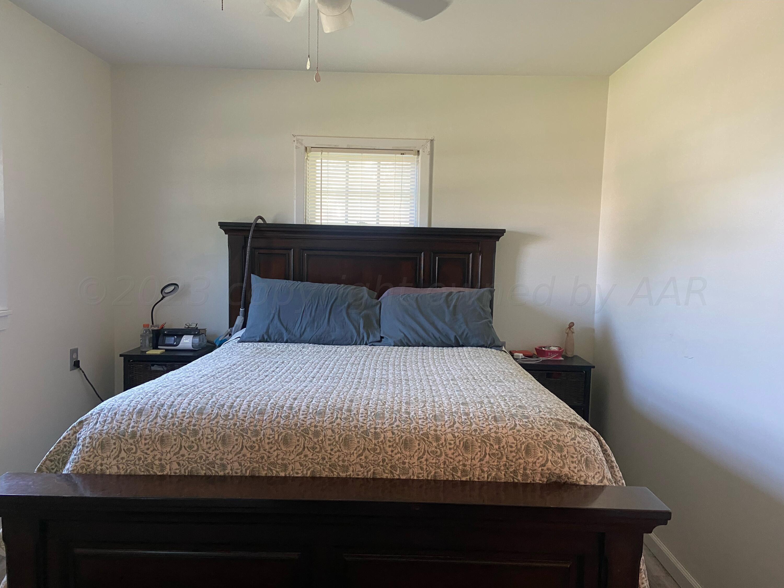 720 Santa Fe Avenue Channing, TX 79018 - Photo 19 of 23 a bedroom with a bed and window