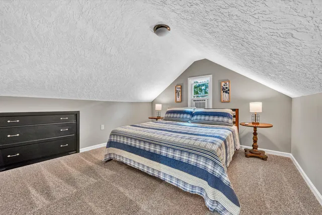a bathroom with a sink mirror and vanity