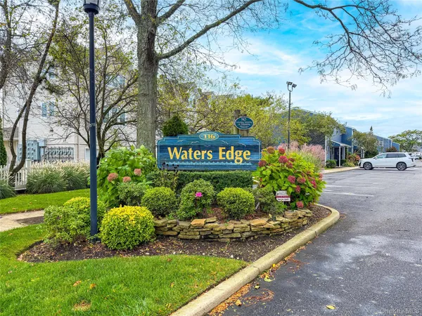 a view of sign board with a yard