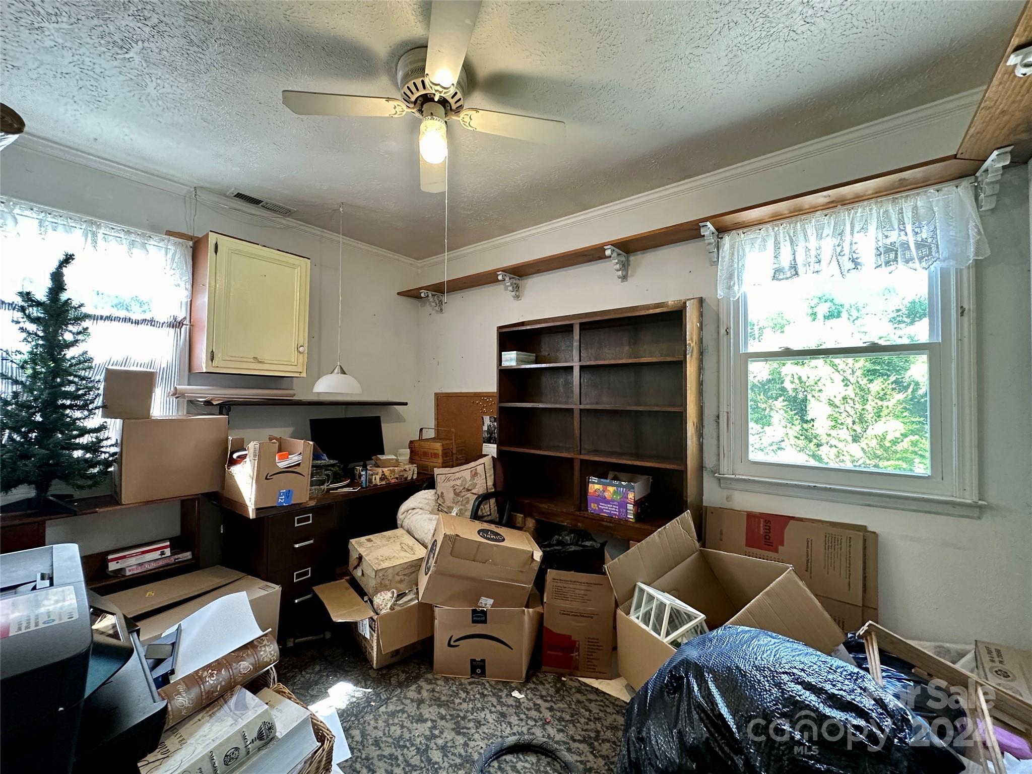 282 Berkeley Road Hendersonville, NC 28792 - Photo 12 of 25 a living room with furniture fireplace and a large window