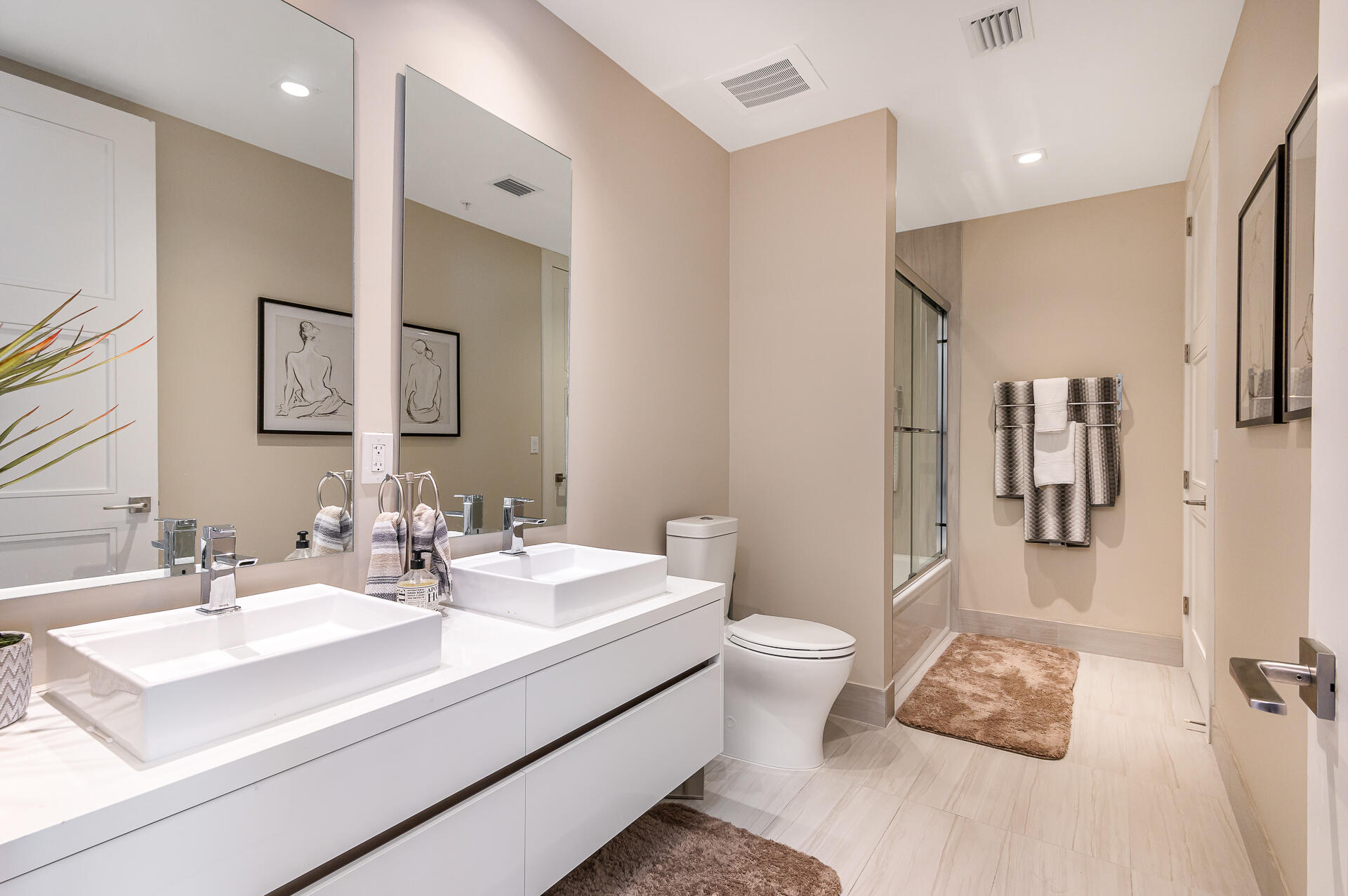 155 East Boca Raton Road, Unit 1012 Boca Raton, FL 33432 - Photo 7 of 41 a bathroom with a sink toilet and shower
