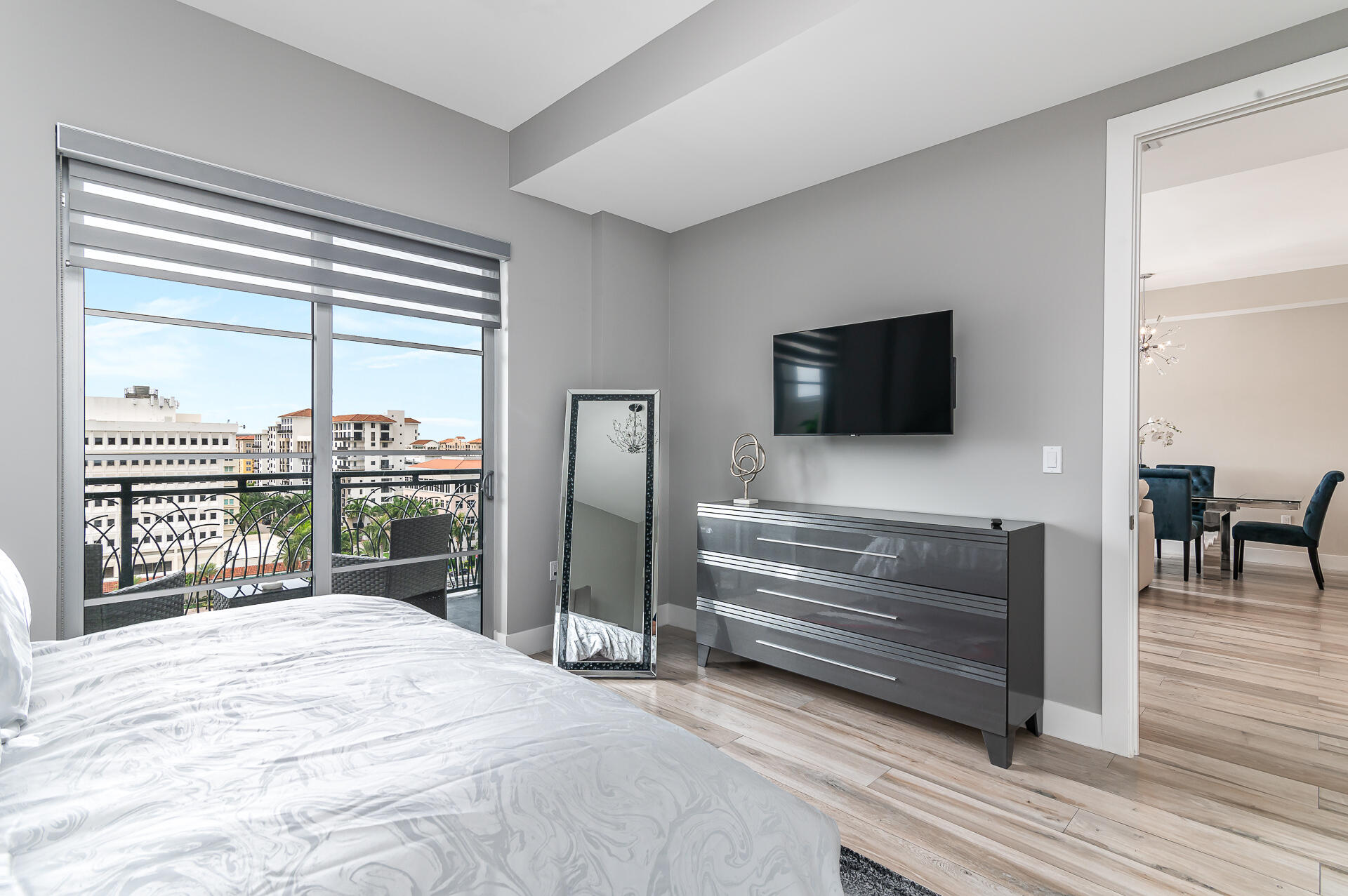 155 East Boca Raton Road, Unit 1012 Boca Raton, FL 33432 - Photo 9 of 41 a bedroom with a bed and a flat screen tv