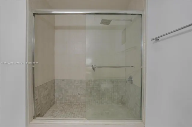 a living room with furniture rug and wooden floor