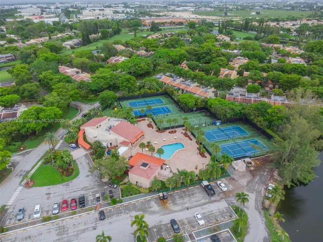 an aerial view of a house with a garden