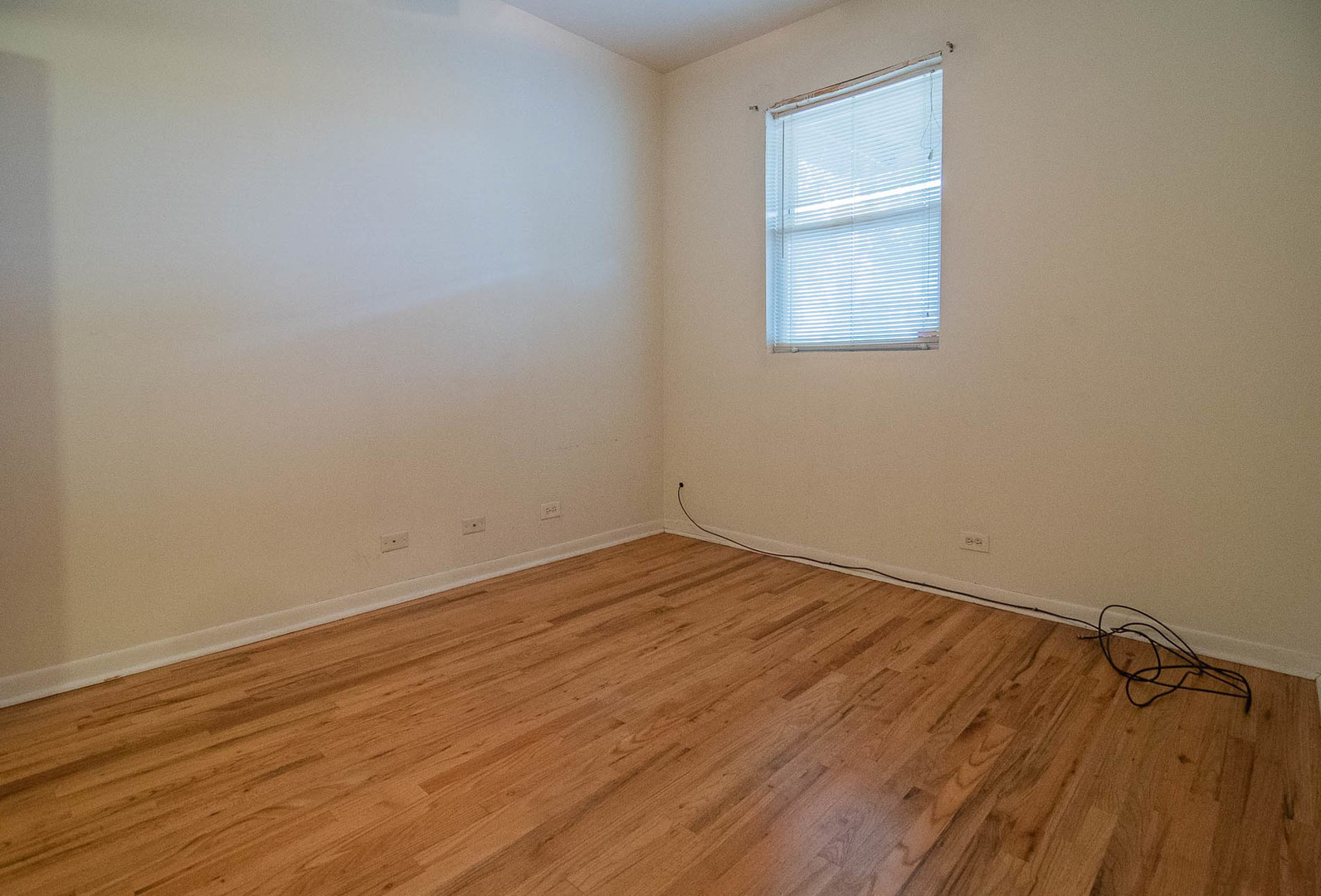 905 North Racine Avenue, Unit 2 Chicago, IL 60642 - Photo 23 of 26 a view of a room with wooden floor and windows