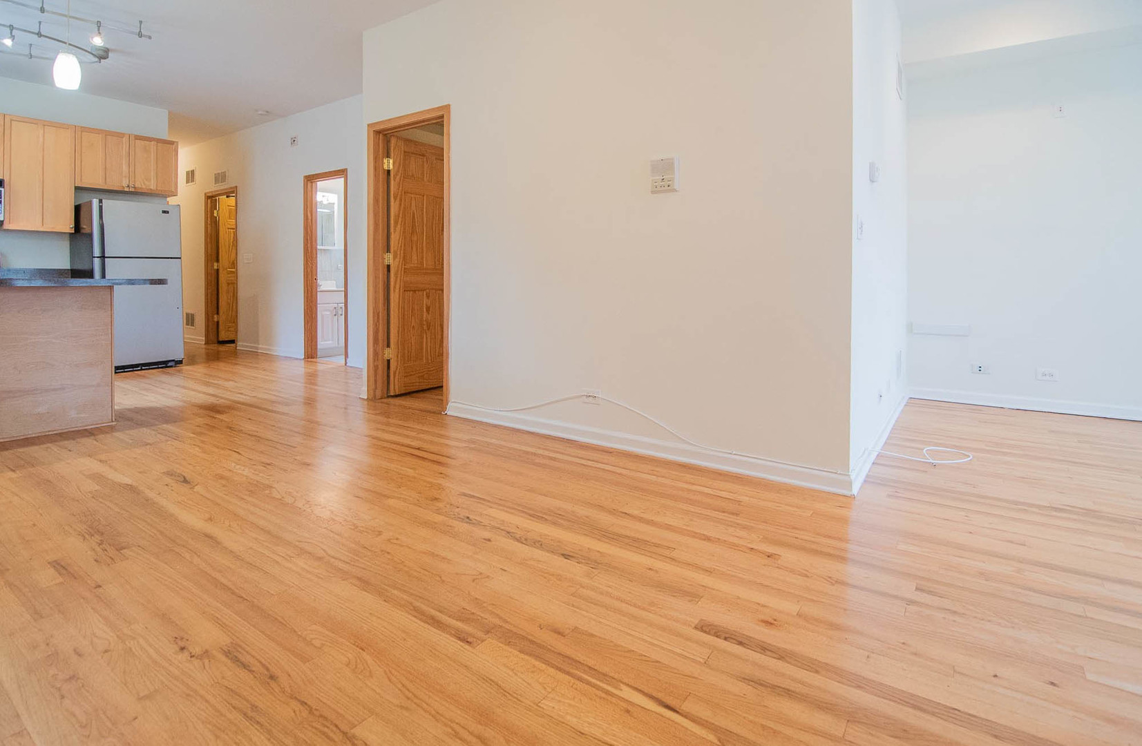 905 North Racine Avenue, Unit 2 Chicago, IL 60642 - Photo 9 of 26 a view of a kitchen from a hallway