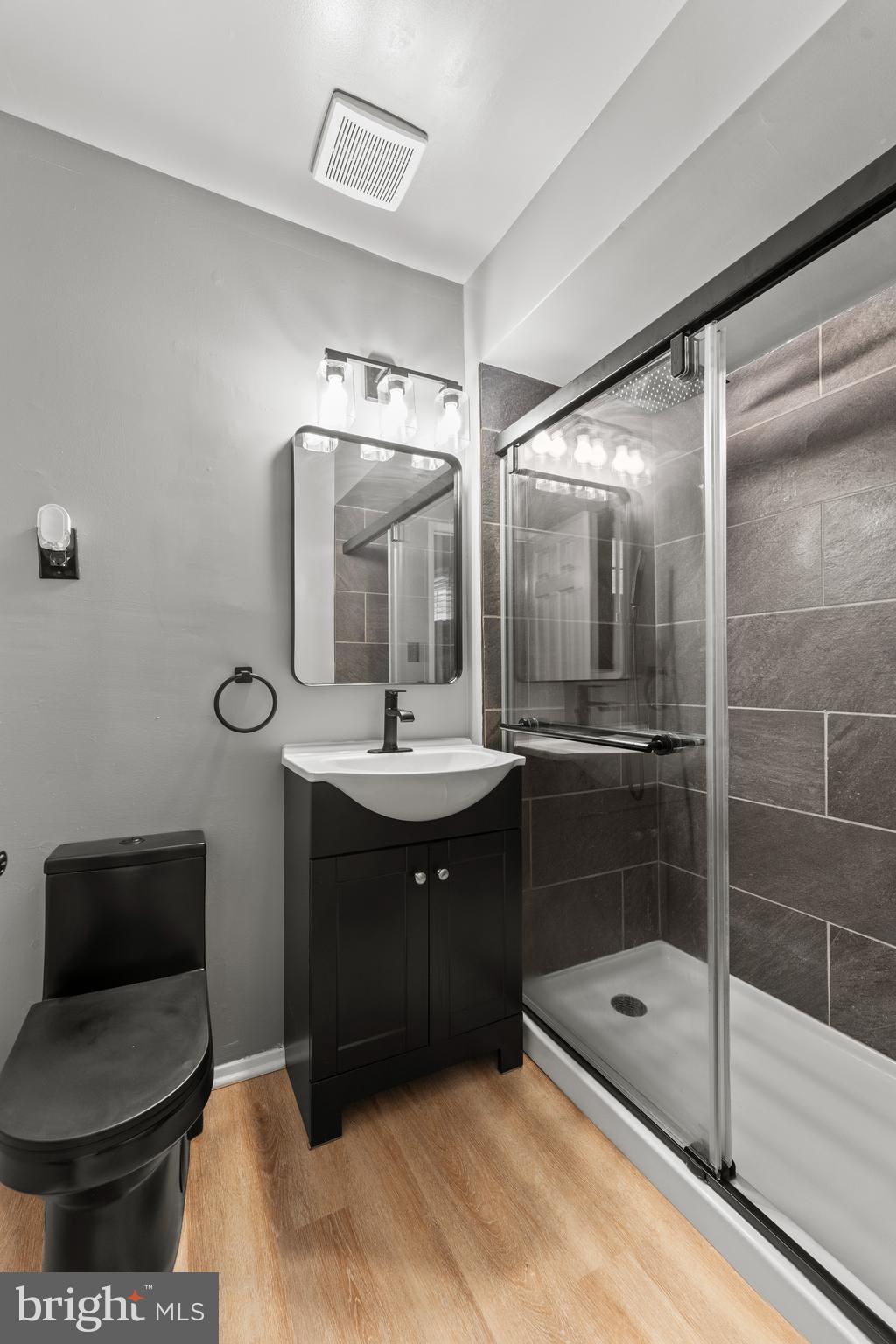 1922 Brookdale Road Baltimore, MD 21244 - Photo 17 of 33 a bathroom with a sink a toilet and shower