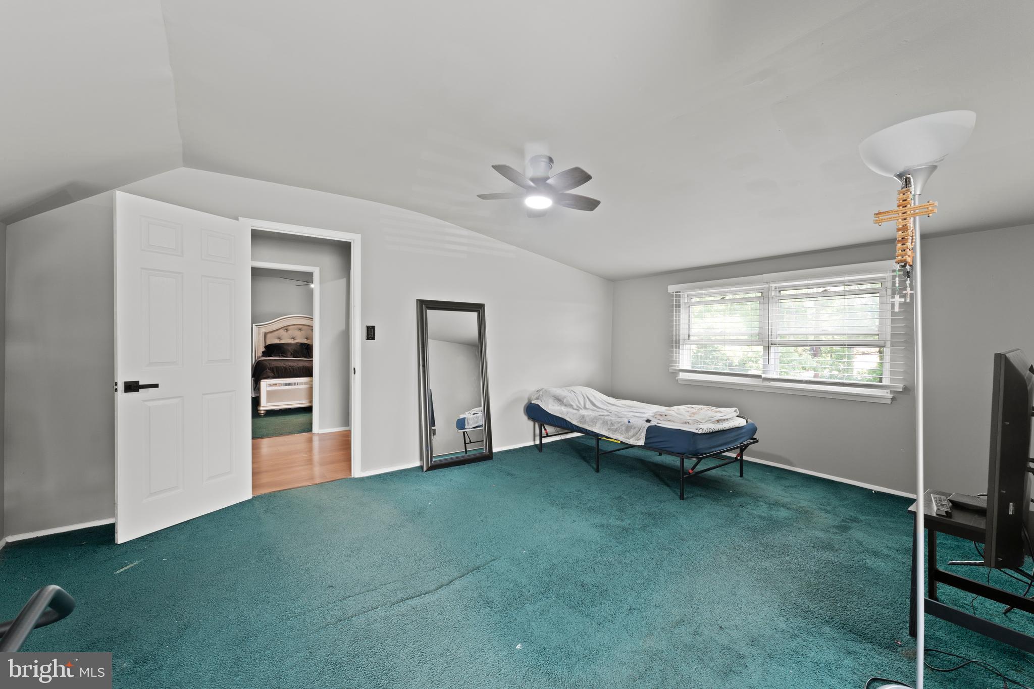 1922 Brookdale Road Baltimore, MD 21244 - Photo 23 of 33 a living room with furniture a window and a chandelier