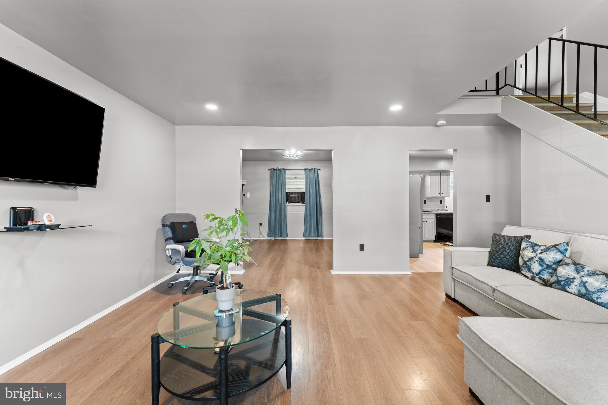 1922 Brookdale Road Baltimore, MD 21244 - Photo 3 of 33 a living room with furniture and a flat screen tv