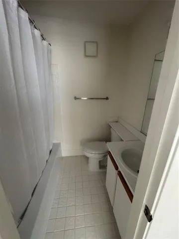 a bathroom with a sink and toilet