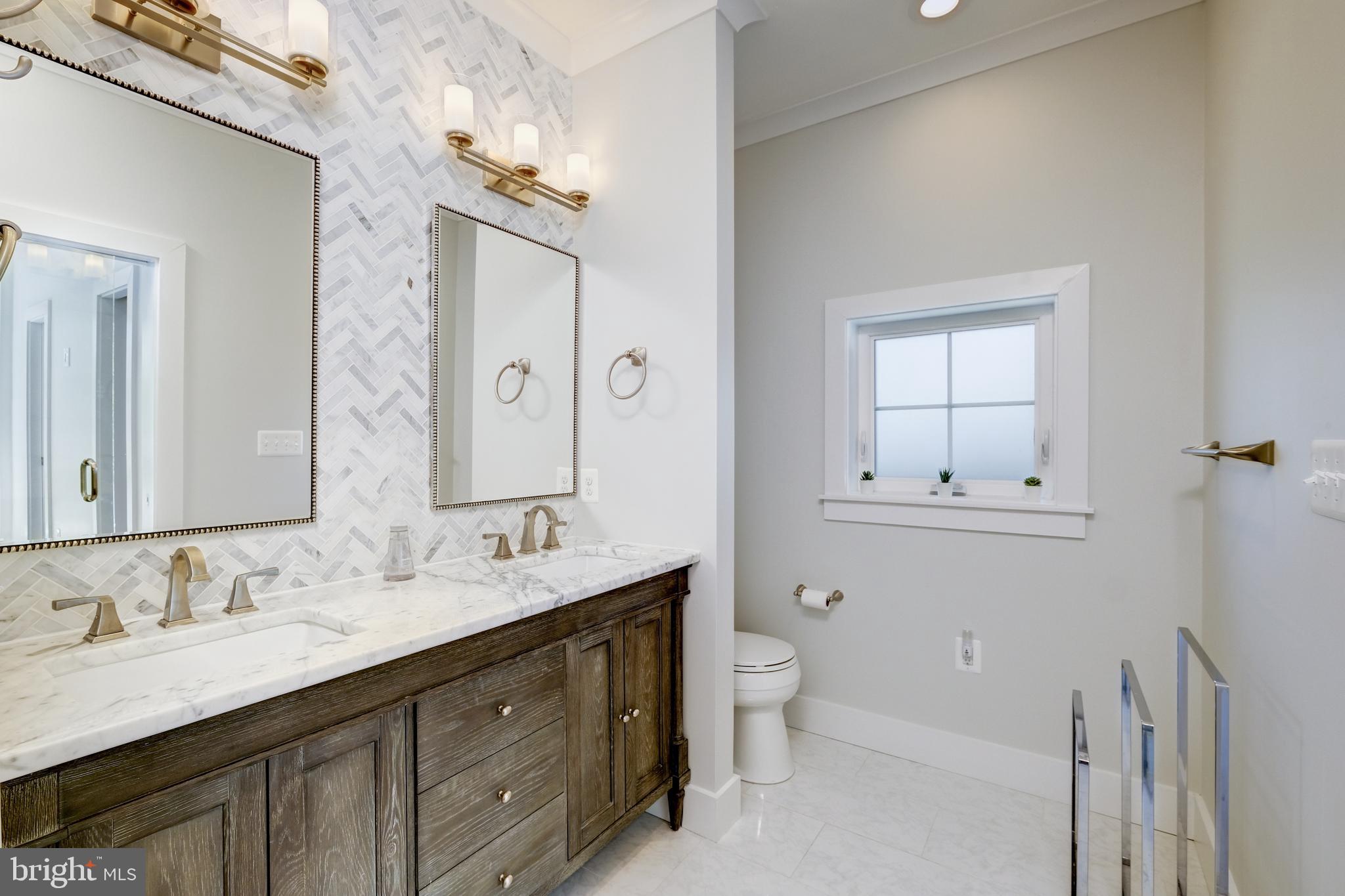 822 Violet Place Silver Spring, MD 20910 - Photo 22 of 40 Herring Bone Tile-Work @ Vanity + Dual Vanity