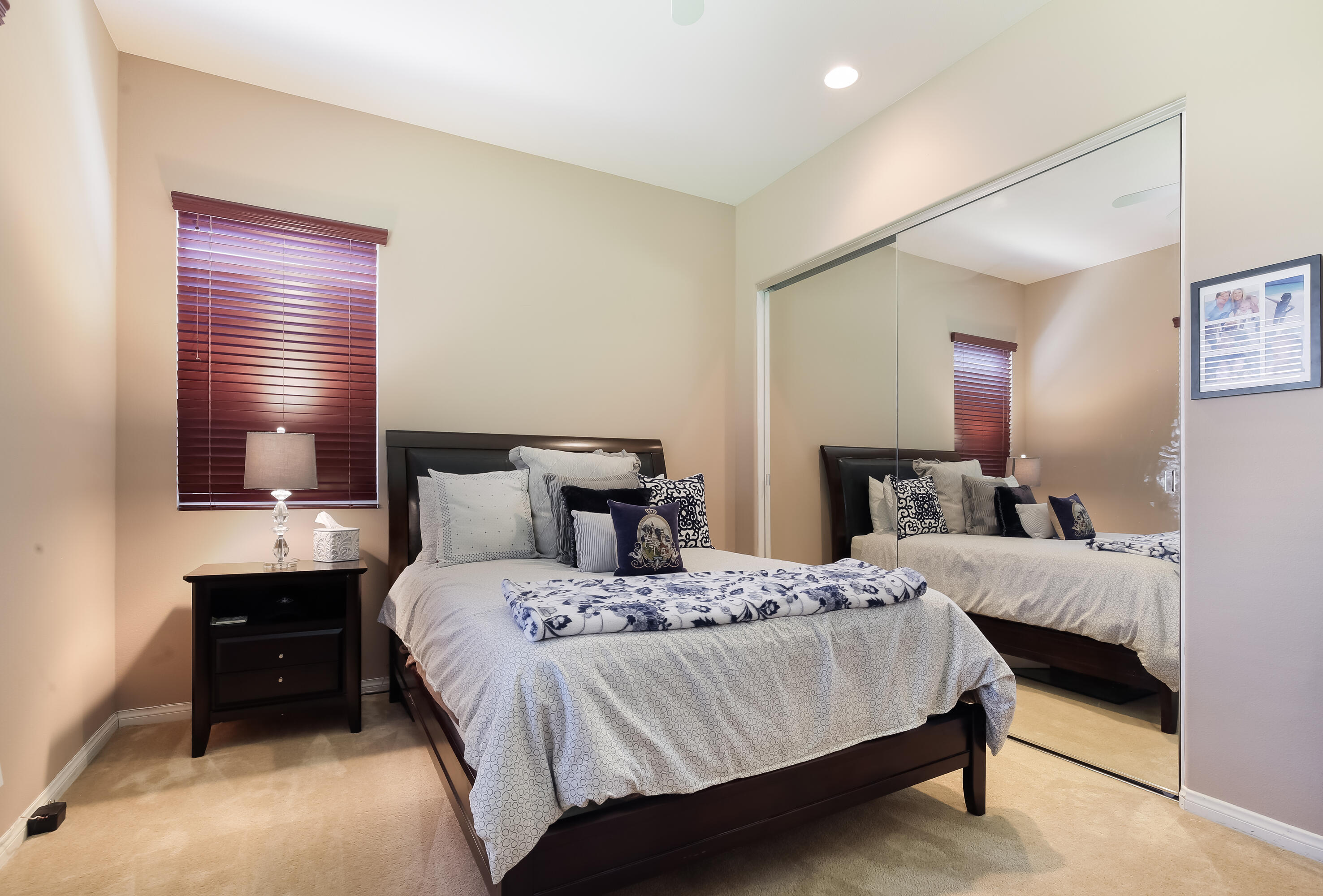 153 Bellini Way Palm Desert, CA 92211 - Photo 17 of 26 a bedroom with a bed and a tv