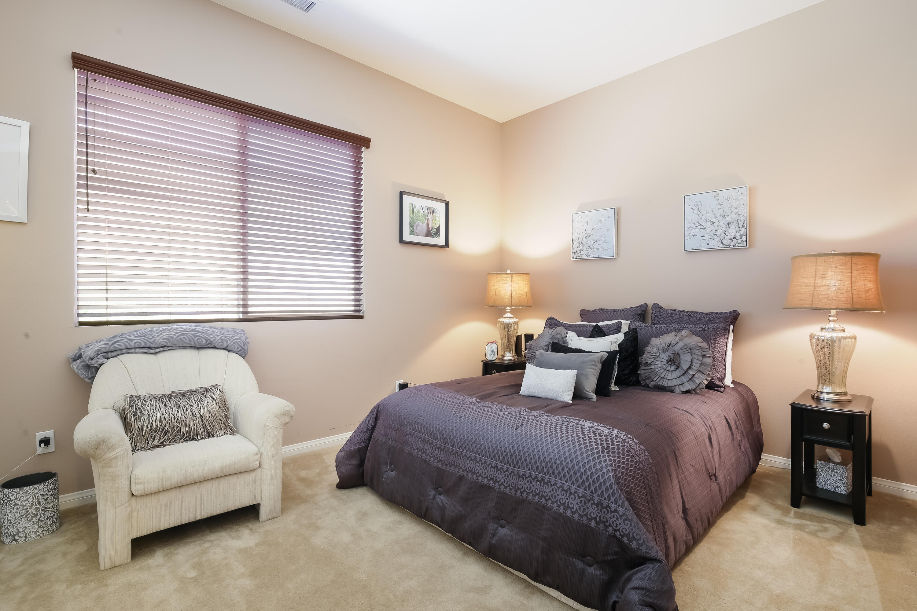 153 Bellini Way Palm Desert, CA 92211 - Photo 19 of 26 a bedroom with bed and a couch