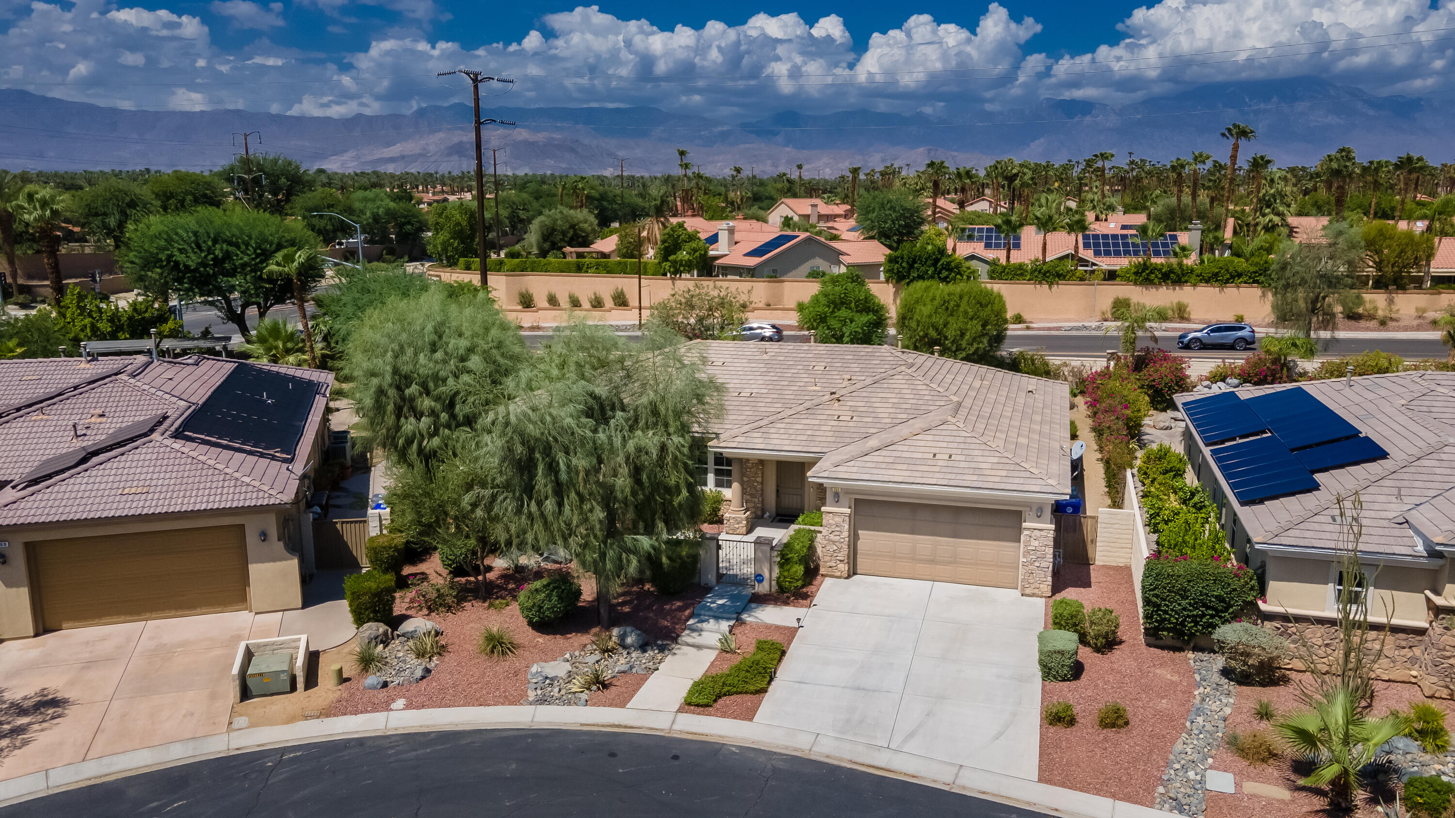 153 Bellini Way Palm Desert, CA 92211 - Photo 23 of 26 an aerial view of multiple houses with yard
