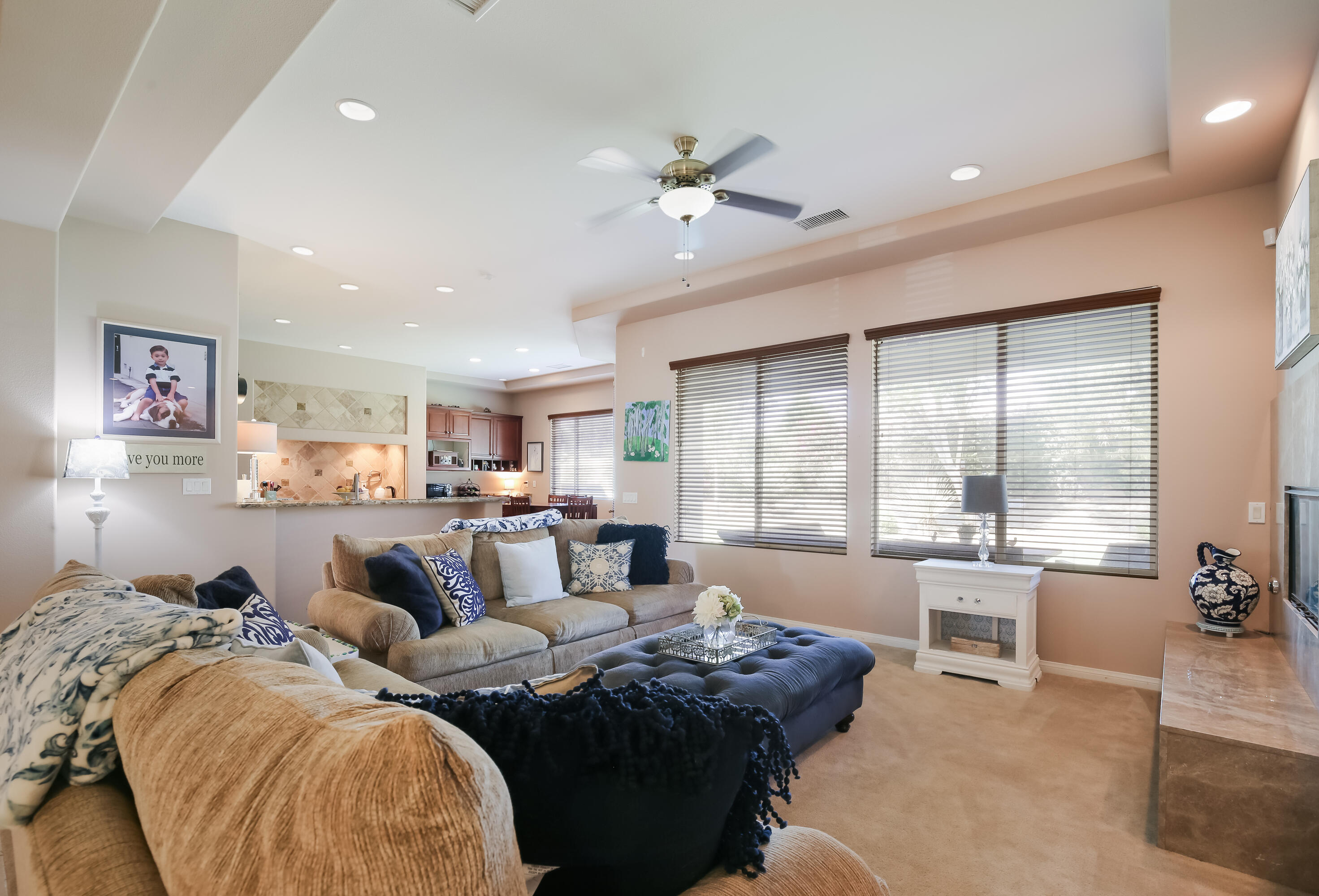 153 Bellini Way Palm Desert, CA 92211 - Photo 8 of 26 a living room with furniture and large windows