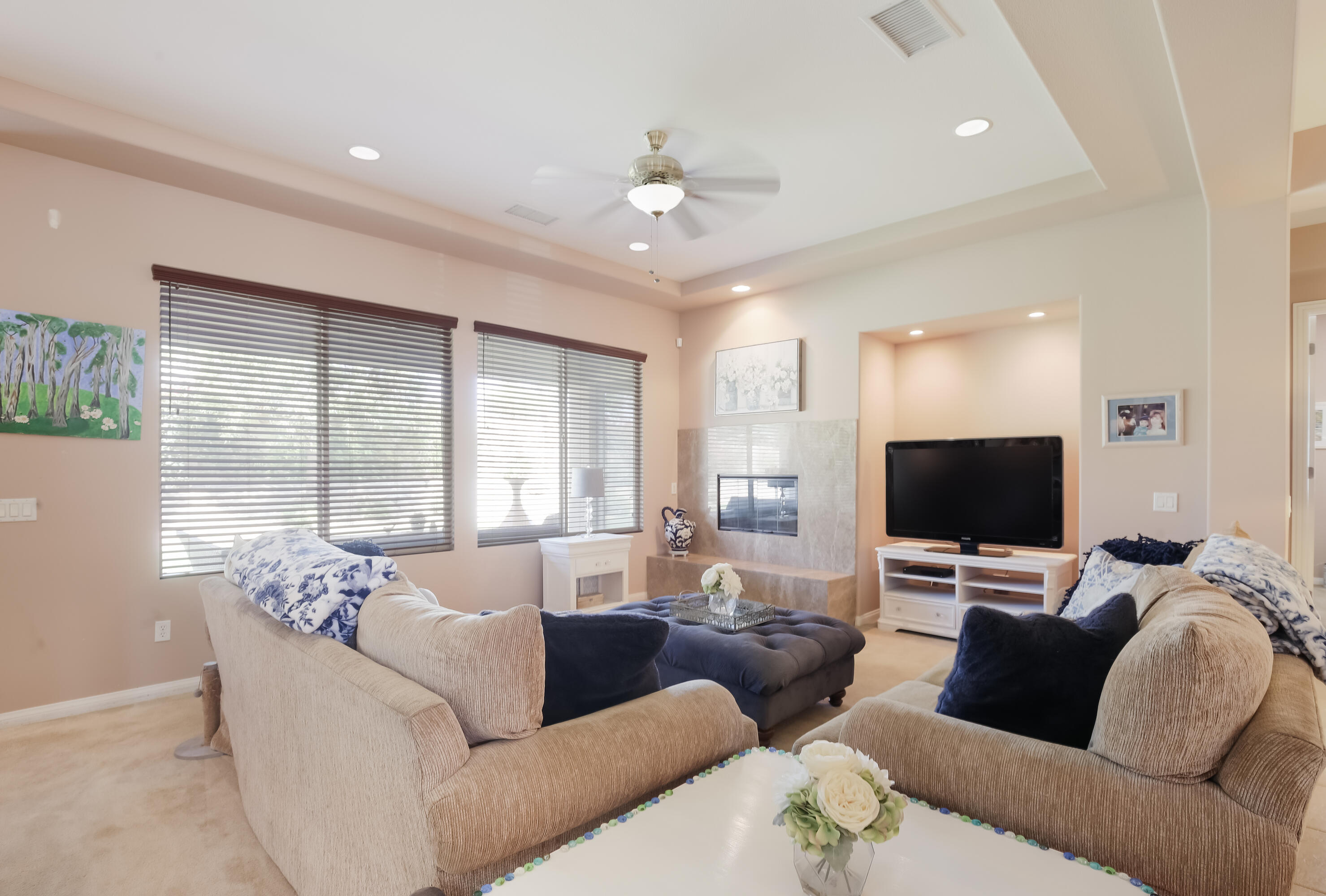 153 Bellini Way Palm Desert, CA 92211 - Photo 9 of 26 a living room with furniture and a flat screen tv