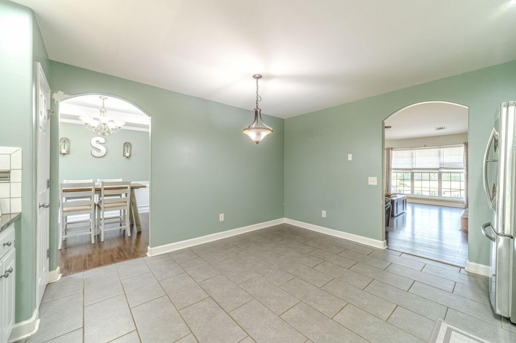536 San Dra Way Monroe, GA 30656 - Photo 13 of 30 wooden floor in an empty room with a window