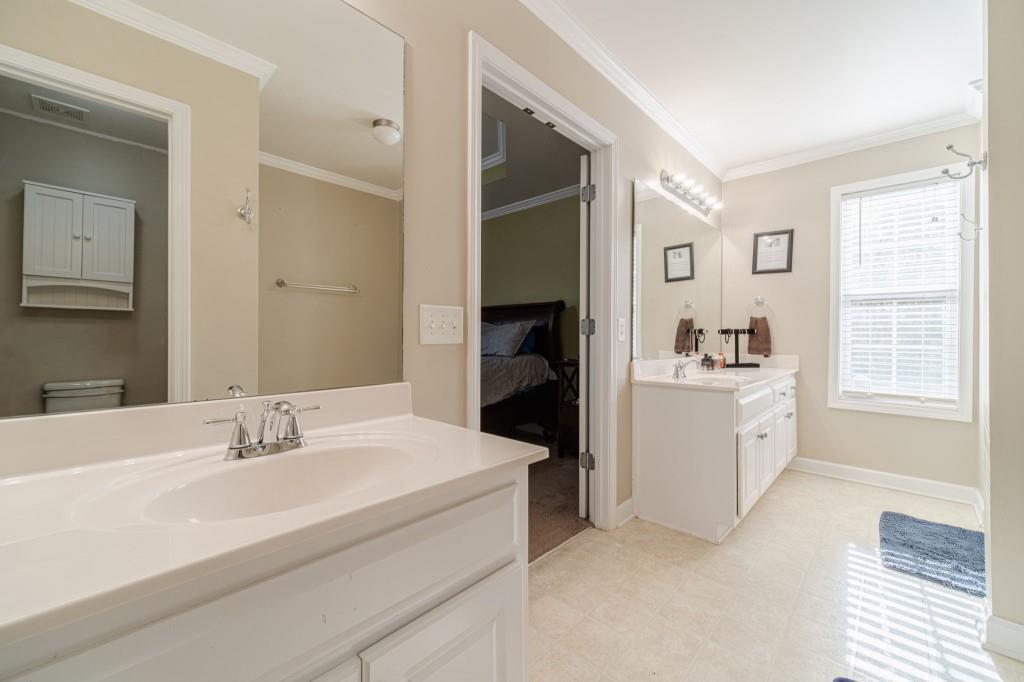 536 San Dra Way Monroe, GA 30656 - Photo 21 of 30 a bathroom with a sink double vanity and a tub