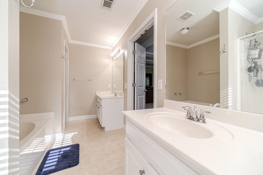536 San Dra Way Monroe, GA 30656 - Photo 22 of 30 a bathroom with a sink and a mirror