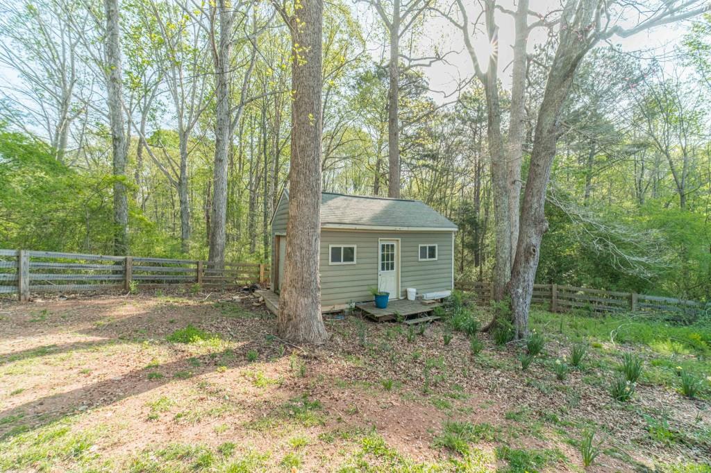 536 San Dra Way Monroe, GA 30656 - Photo 28 of 30 a view of a house with a yard and large trees