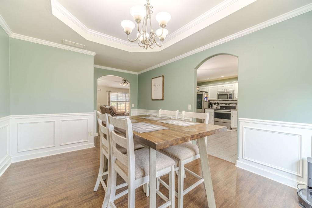 536 San Dra Way Monroe, GA 30656 - Photo 7 of 30 a view of a dining room with furniture and wooden floor