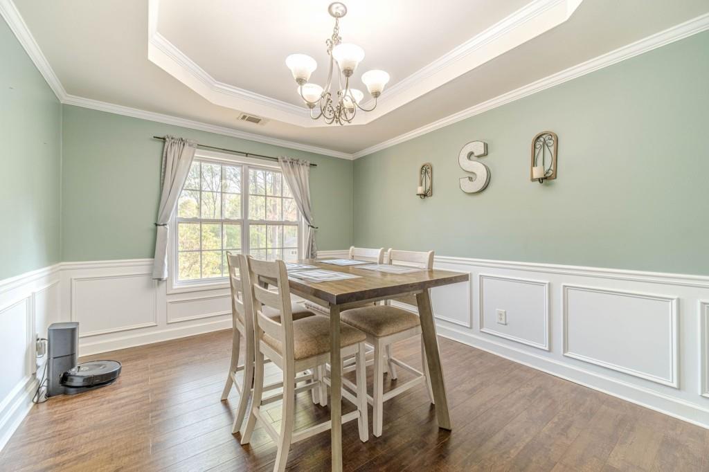 536 San Dra Way Monroe, GA 30656 - Photo 8 of 30 a view of a dining room with furniture window and wooden floor