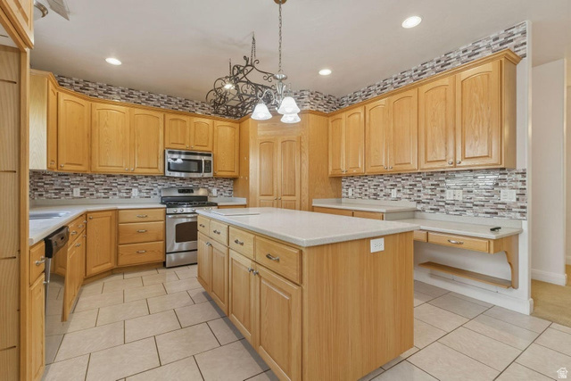 1001 Pine Valley Road Pine Valley, UT 84781 - Photo 17 of 49 Kitchen featuring light tile patterned floors, a center island, stainless steel appliances, and light wood finish cabinetry