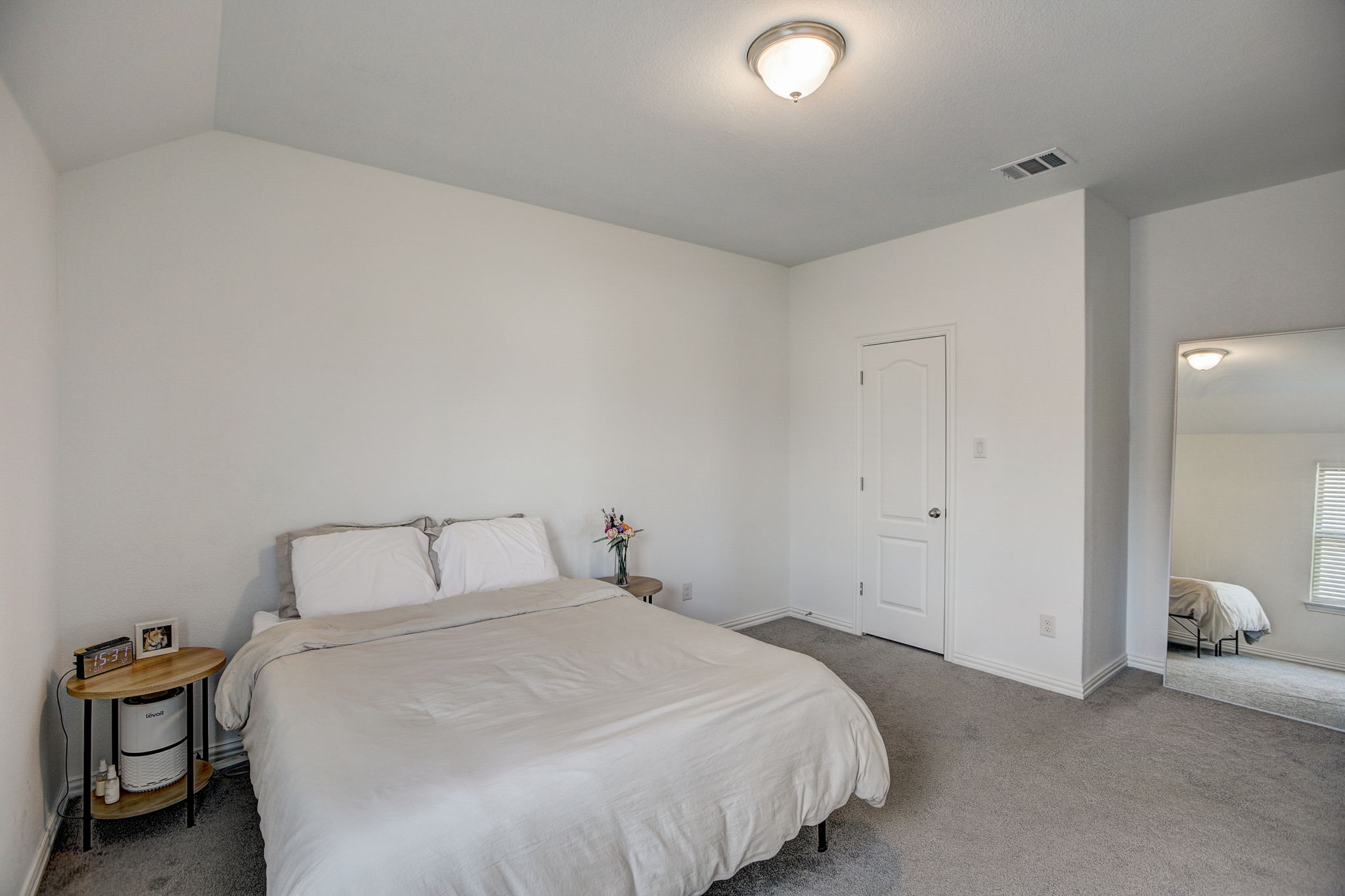 308 Monteforte Road Hutto, TX 78634 - Photo 23 of 32 a bedroom with a bed and chair