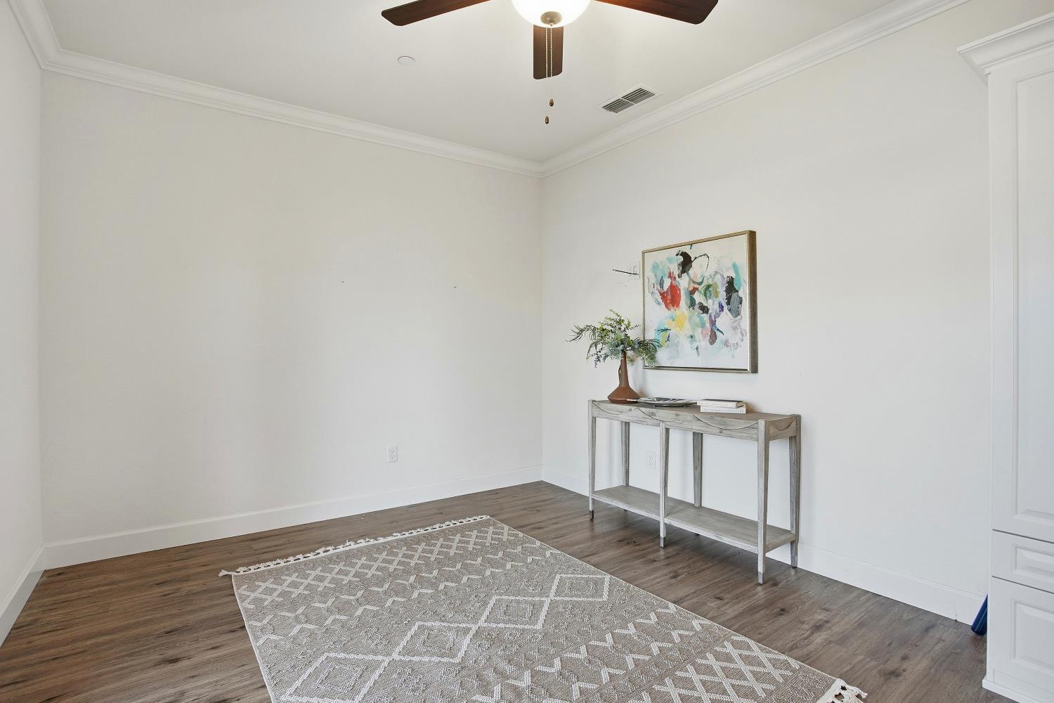 1112 Audrey Court Galt, CA 95632 - Photo 13 of 37 a view of a hallway with wooden floor and workspace