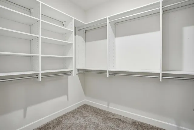 a view of an empty walk in closet
