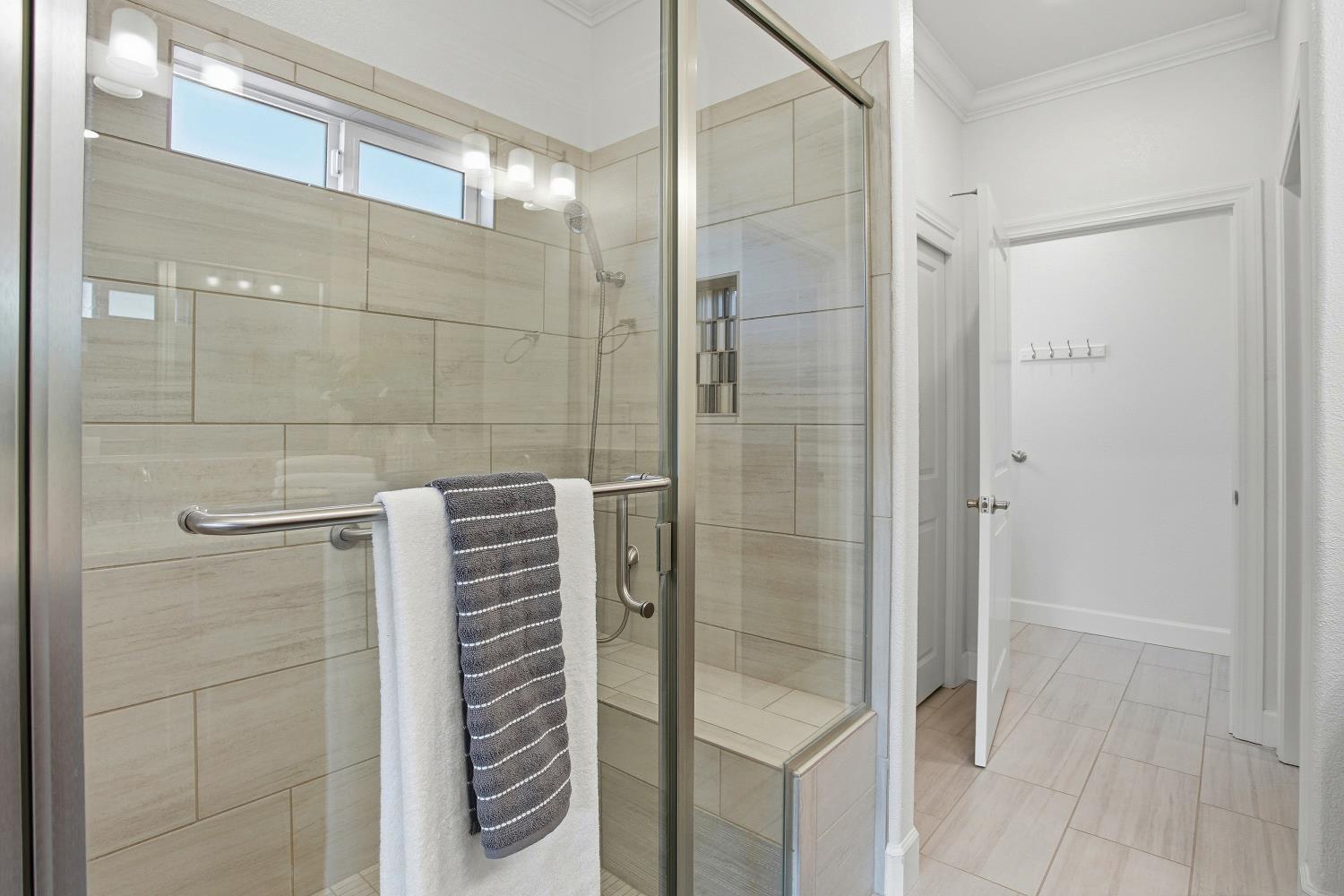 1112 Audrey Court Galt, CA 95632 - Photo 23 of 37 a bathroom with a shower and a glass door