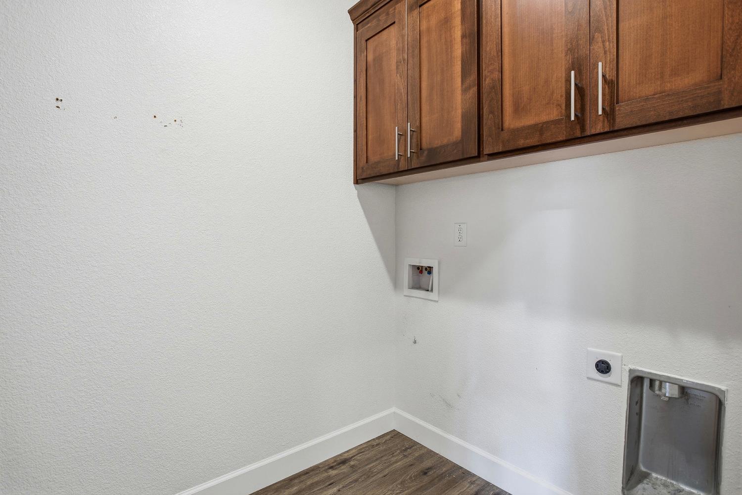 1112 Audrey Court Galt, CA 95632 - Photo 26 of 37 a view of storage and utility room with wooden floor
