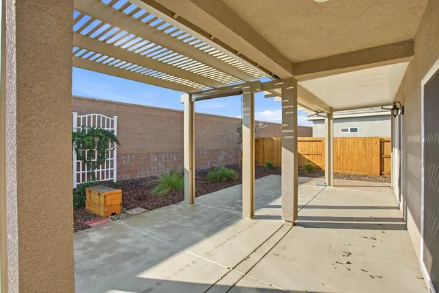 a porch with a glass door and glass door