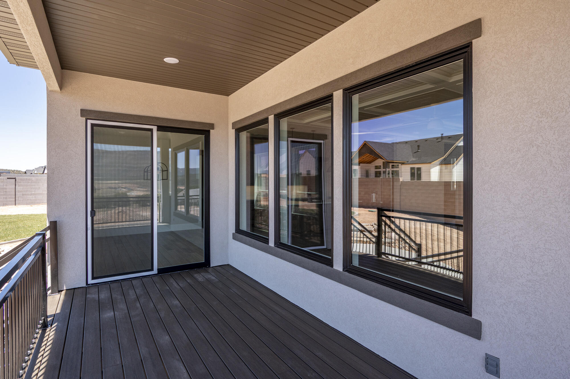 1852 South Hidden Canyon Road Cedar City, UT 84720 - Photo 60 of 79 The home offers two levels of outdoor living with an upper deck and lower patio, providing plenty of room to relax and gather.